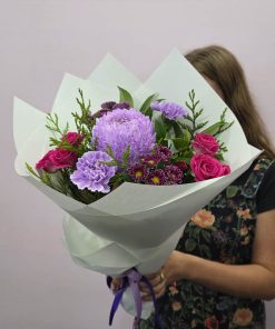 Holding Mauve Posy of Flowers